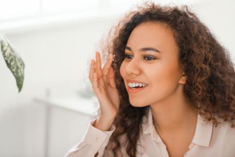 Women using a contact lens Women using a contact lens